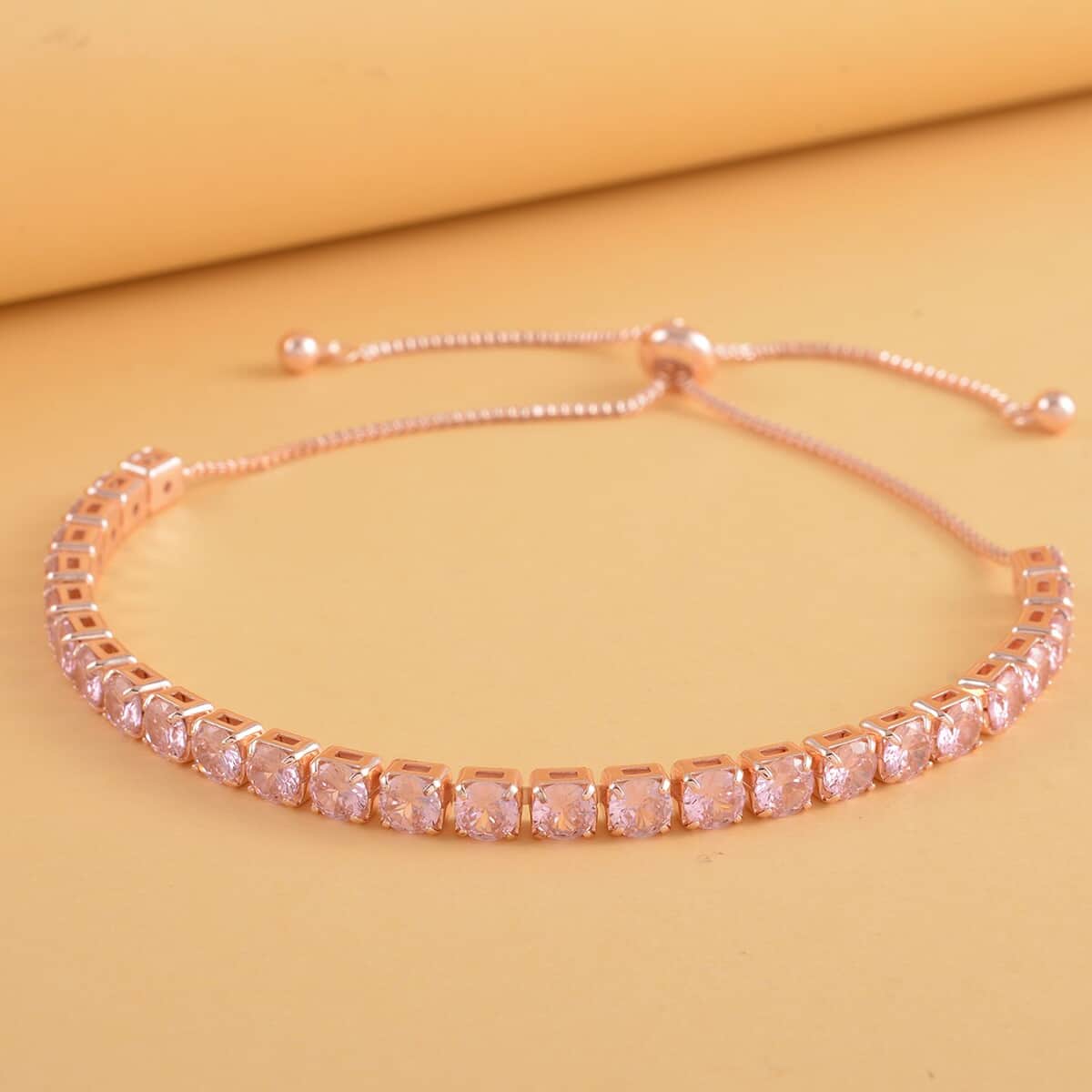 Simulated Red Diamond Tennis Bracelet 6-9Inches with Bolo Slider in Rosetone image number 1