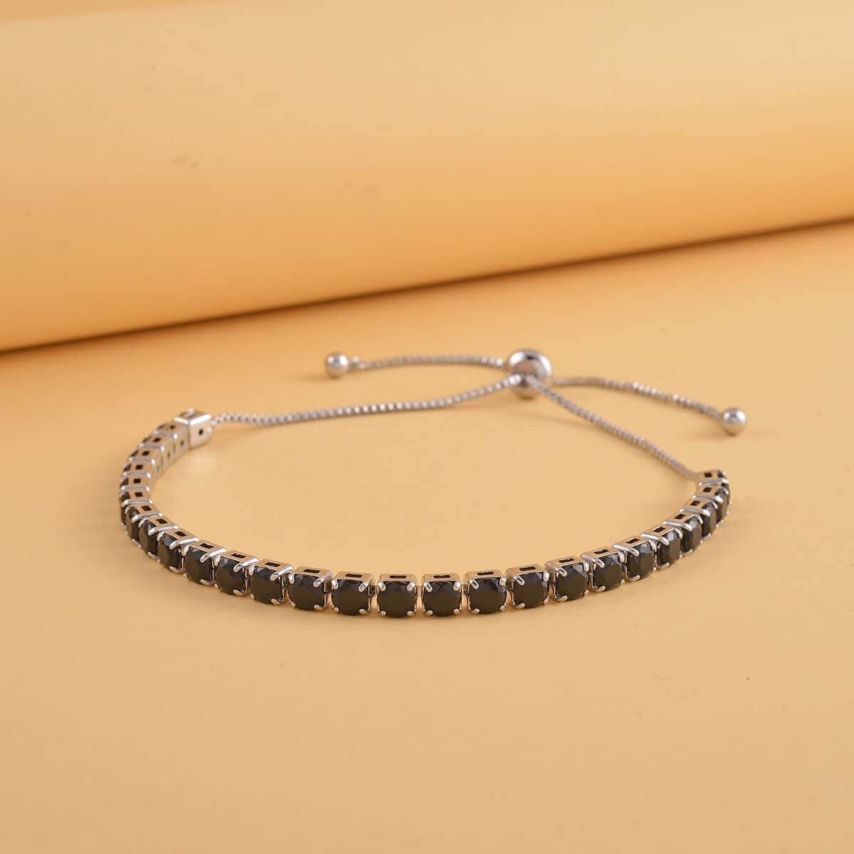 Simulated Black Color Diamond Tennis Bracelet with Bolo Slider in Silvertone 6-9Inches image number 1