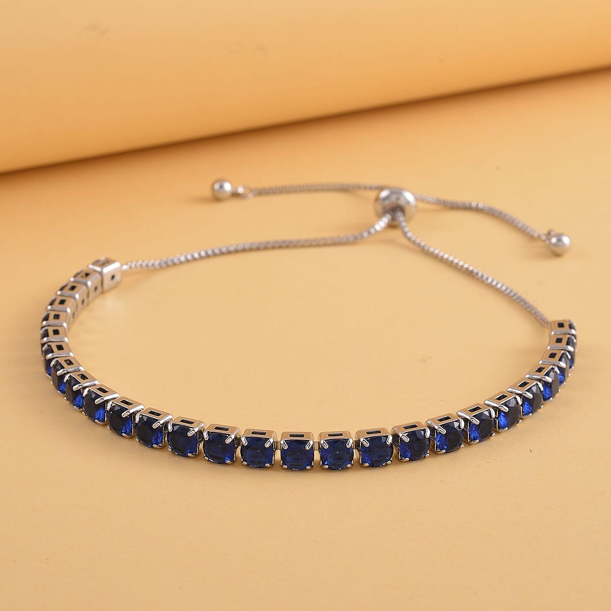 Simulated Sapphire Tennis Bracelet 6-9Inches with Bolo Slider in Silvertone image number 1