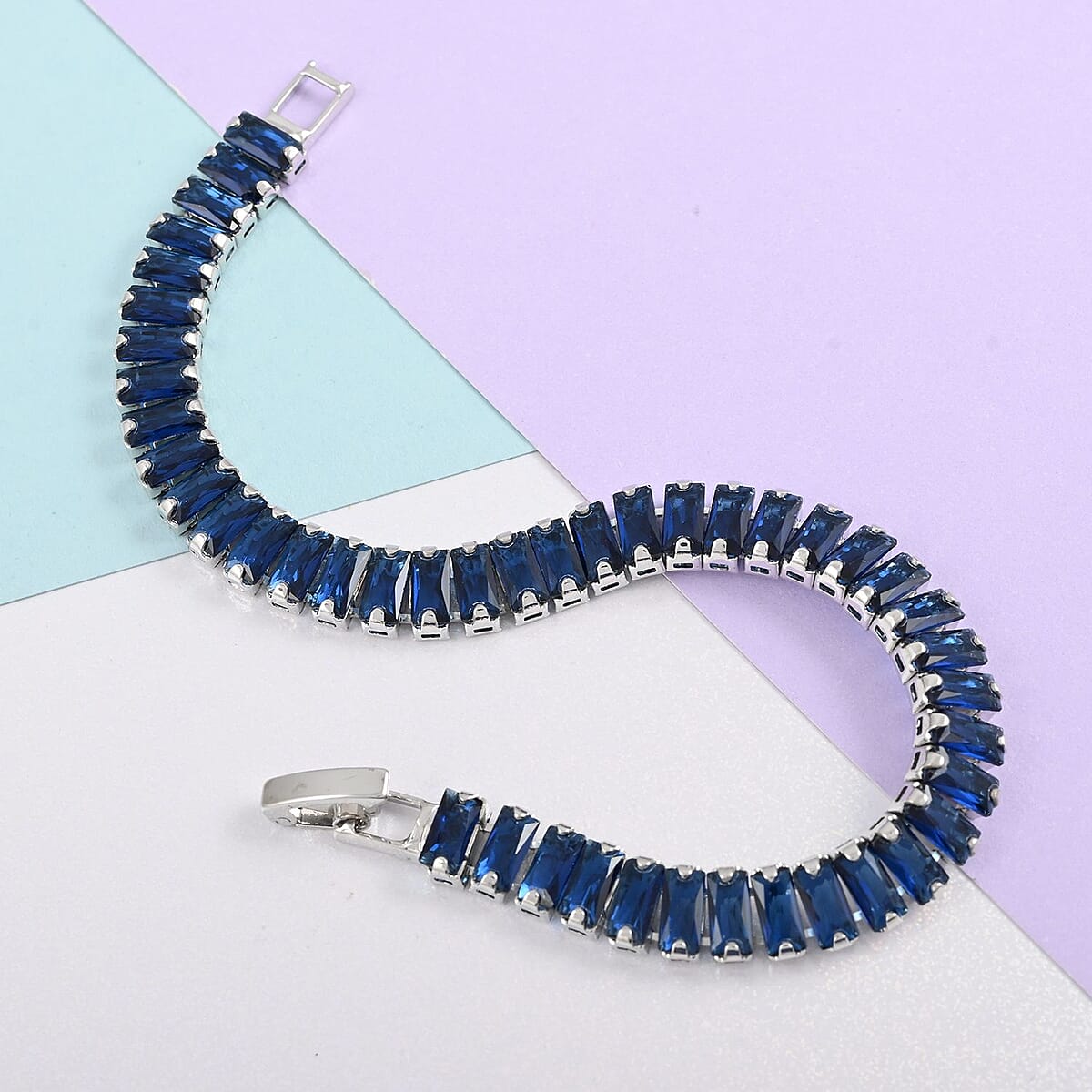 Simulated Dark Blue Diamond Tennis Bracelet in Silvertone (7.00 In) 31.50 ctw image number 1