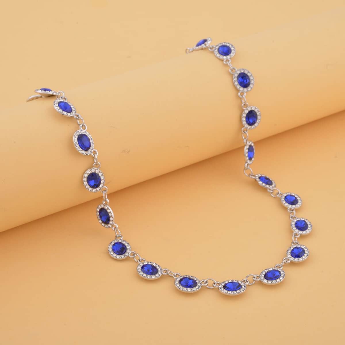 Simulated Blue Sapphire and White Austrian Crystal Necklace 20-22 Inches in Silvertone image number 1
