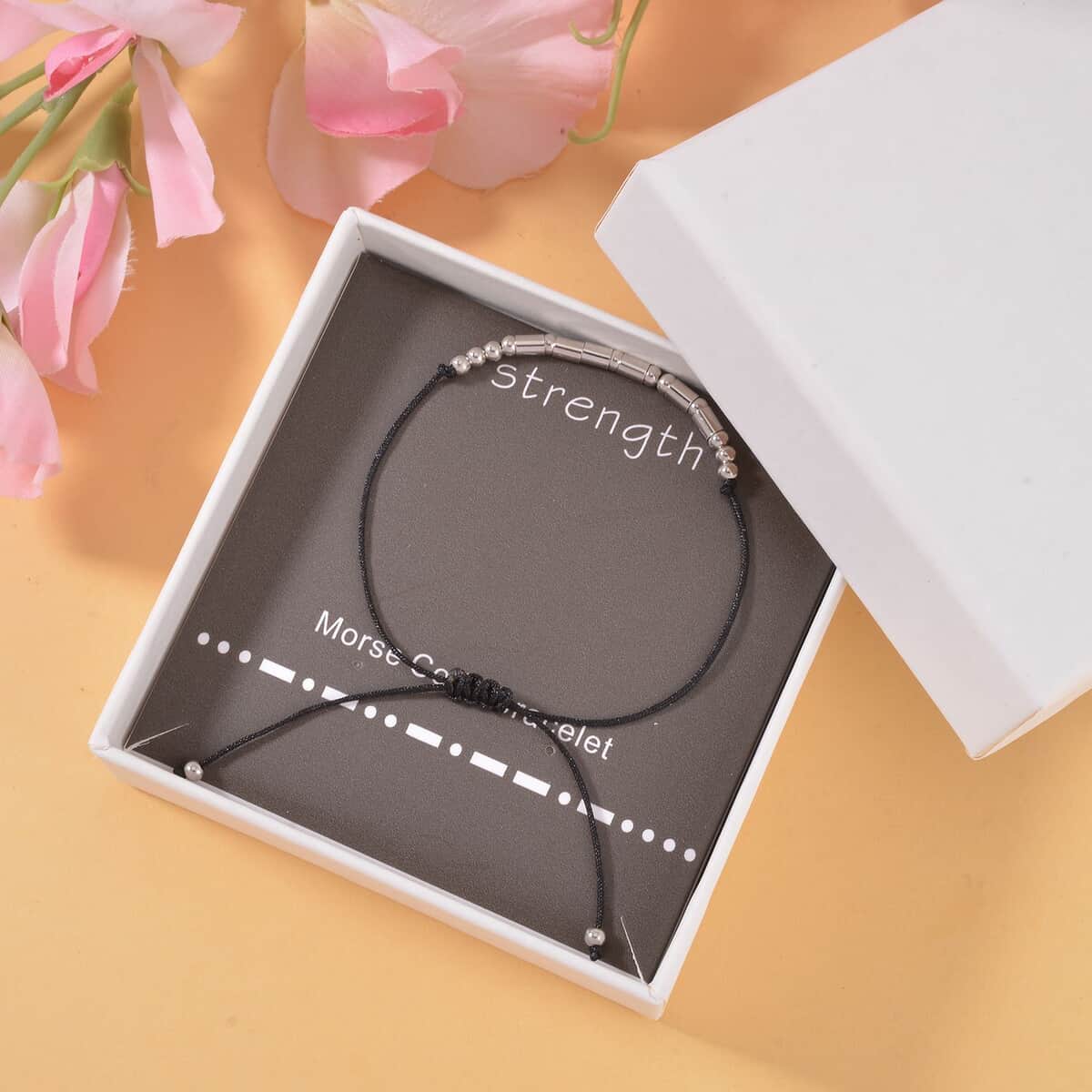 Rhodium Over Sterling Silver Bolo Strength Morse Code Bracelet in Black Cord (Adjustable) image number 1