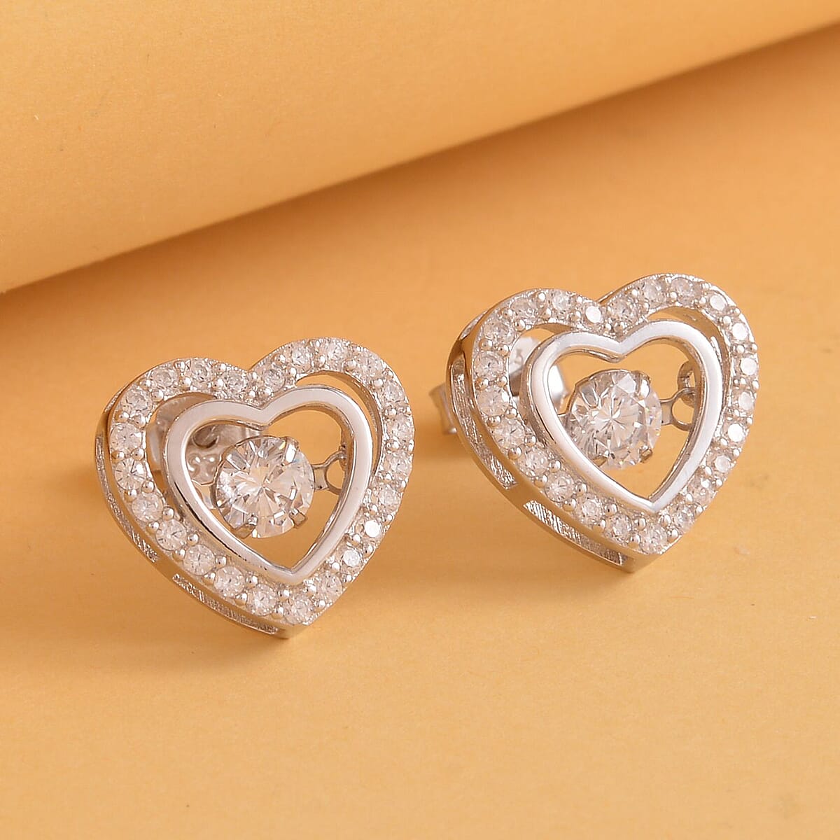 Simulated Diamond Dancing Stone Heart Earrings in Rhodium Over Sterling Silver 1.50 ctw image number 1