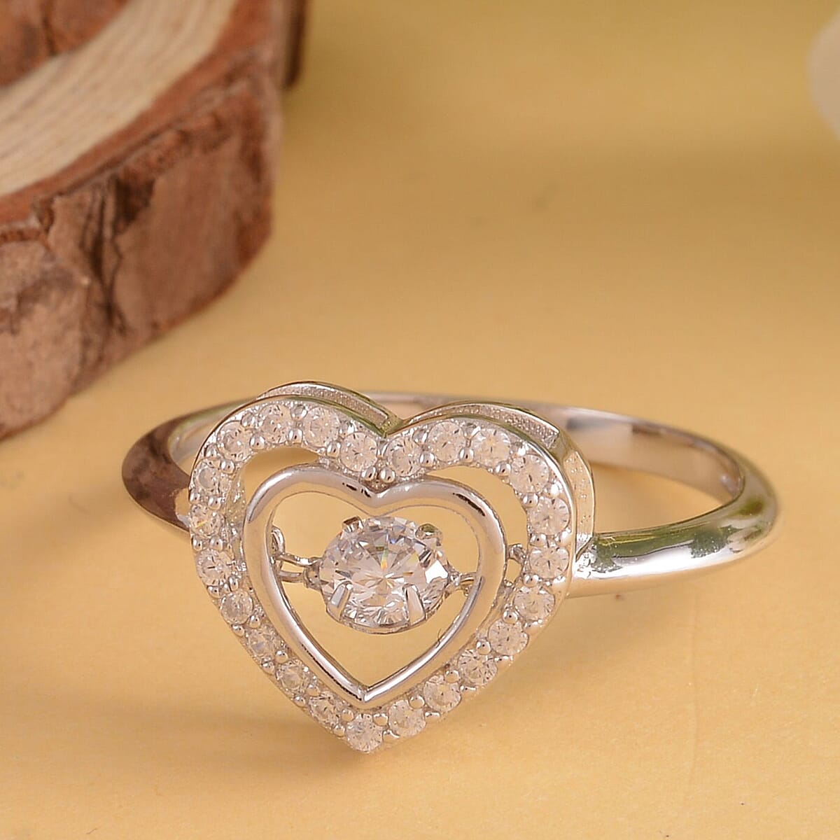 Simulated Diamond Dancing Stone Heart Ring in Rhodium Over Sterling Silver (Size 7.0) 0.75 ctw image number 1