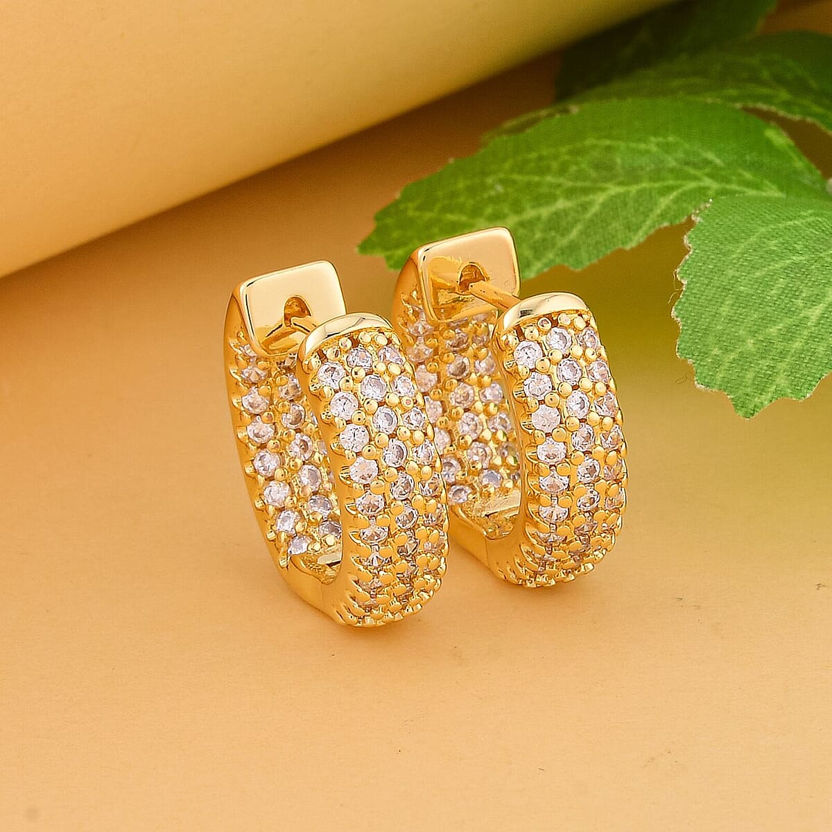 Simulated Diamond Huggie Hoop Earrings in Goldtone 1.00 ctw image number 1