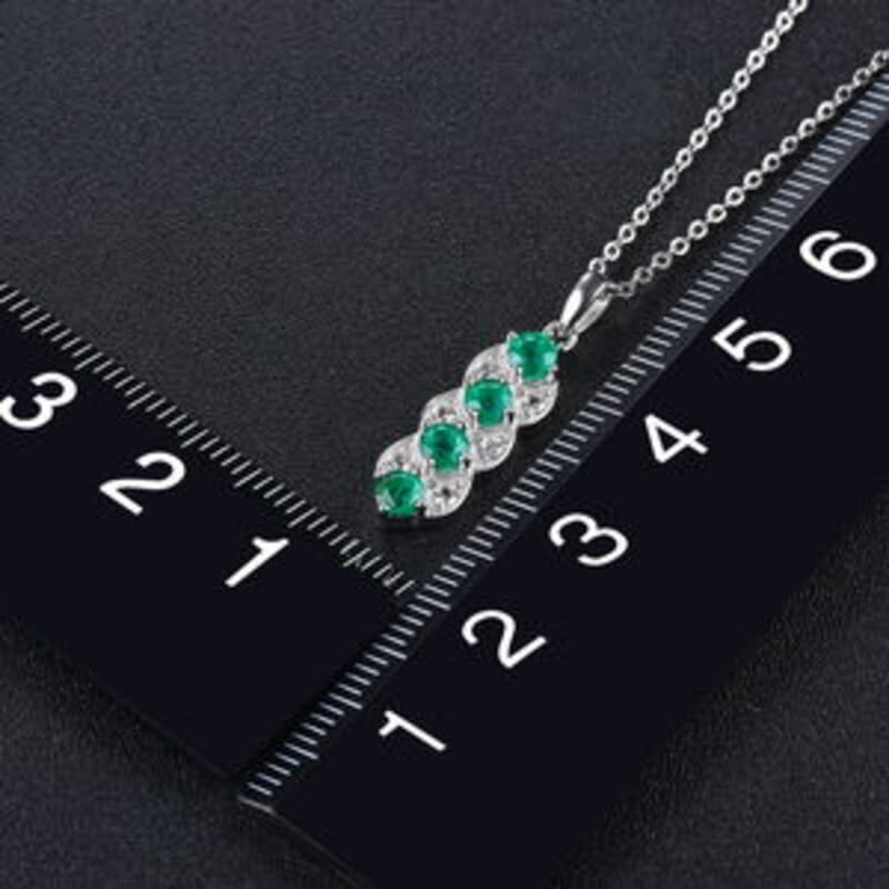 Emerald and White Zircon 0.94 ctw Pendant in Rhodium Over Sterling Silver