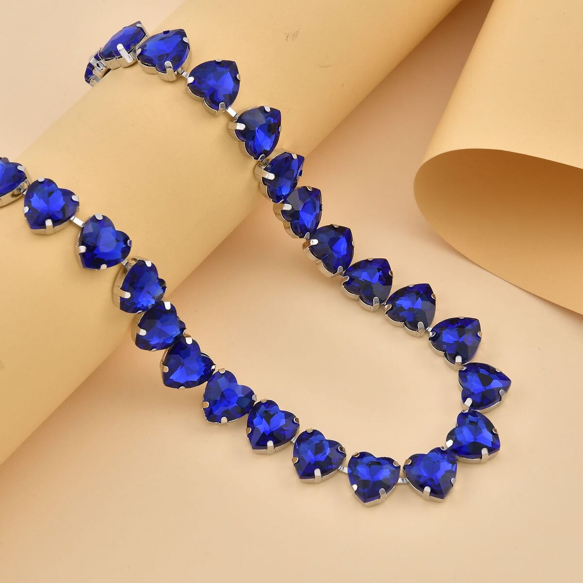 Sapphire Blue Color Glass Heart Necklace 20-22 Inches in Silvertone image number 1