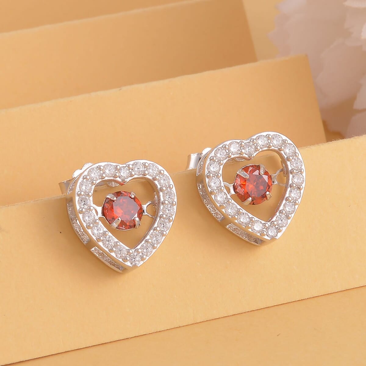 Simulated Red and White Diamond Heart Shape Dancing Earrings in Rhodium Over Sterling Silver 1.50 ctw image number 1