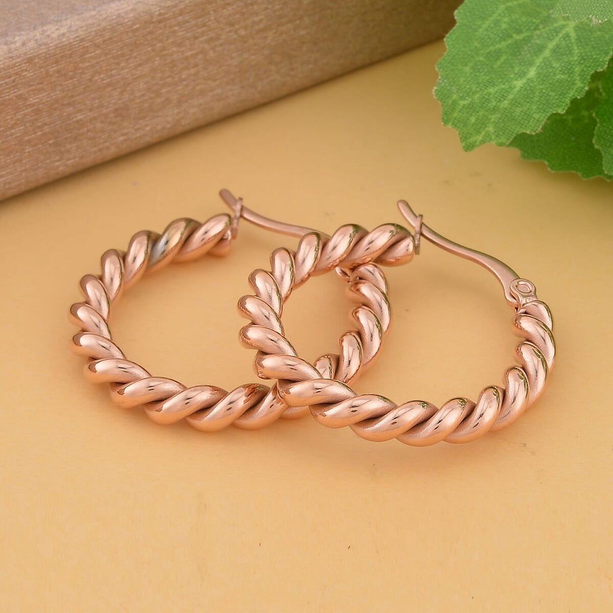 20mm Twisted Hoop Earrings in ION Plated YG Stainless Steel image number 1