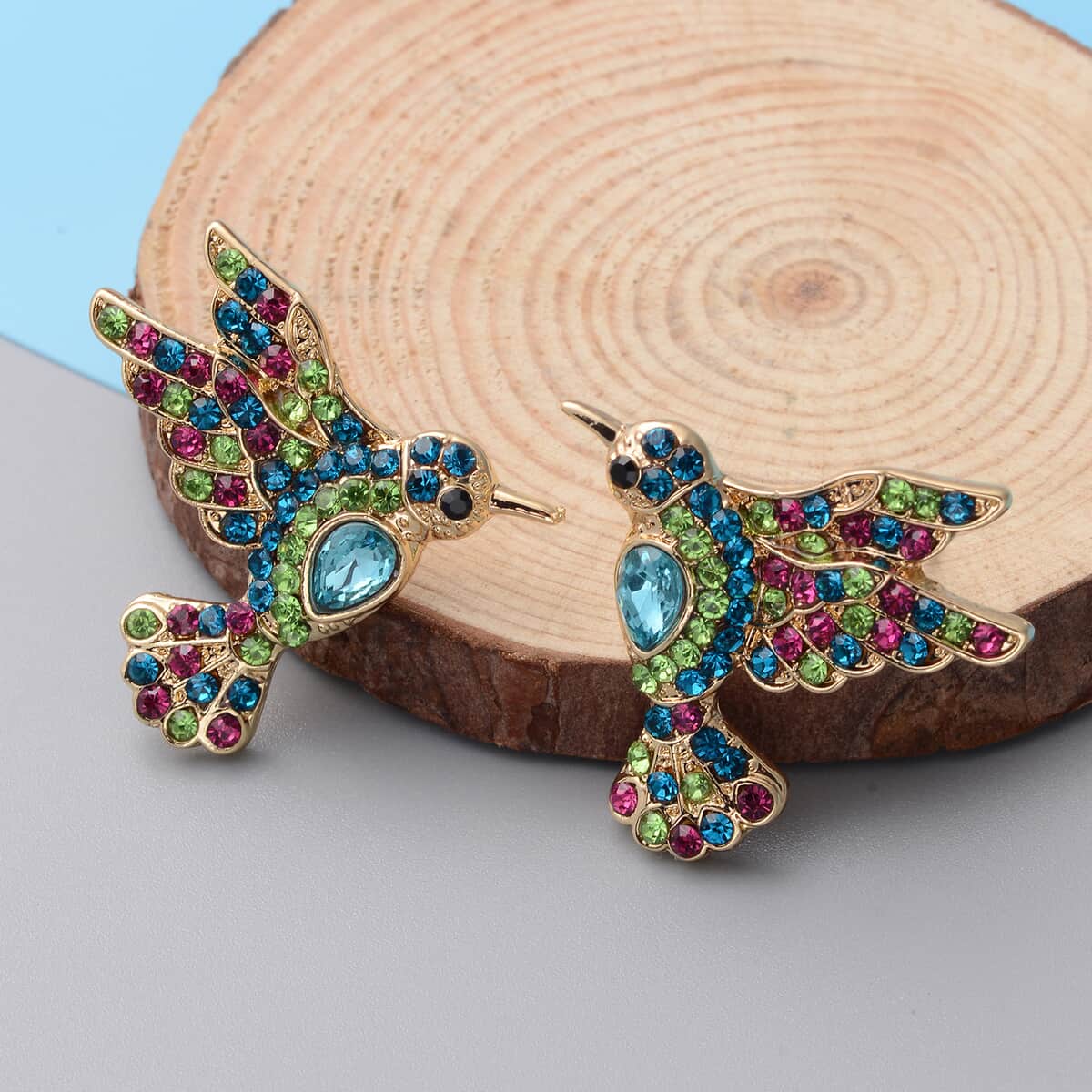 Multi Color Austrian Crystal and Simulated Blue Sapphire Bird Earrings in Goldtone image number 1