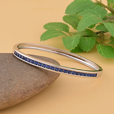 Simulated Blue Sapphire Color Diamond Bangle Bracelet in Silvertone (6.00 in) 2.85 ctw