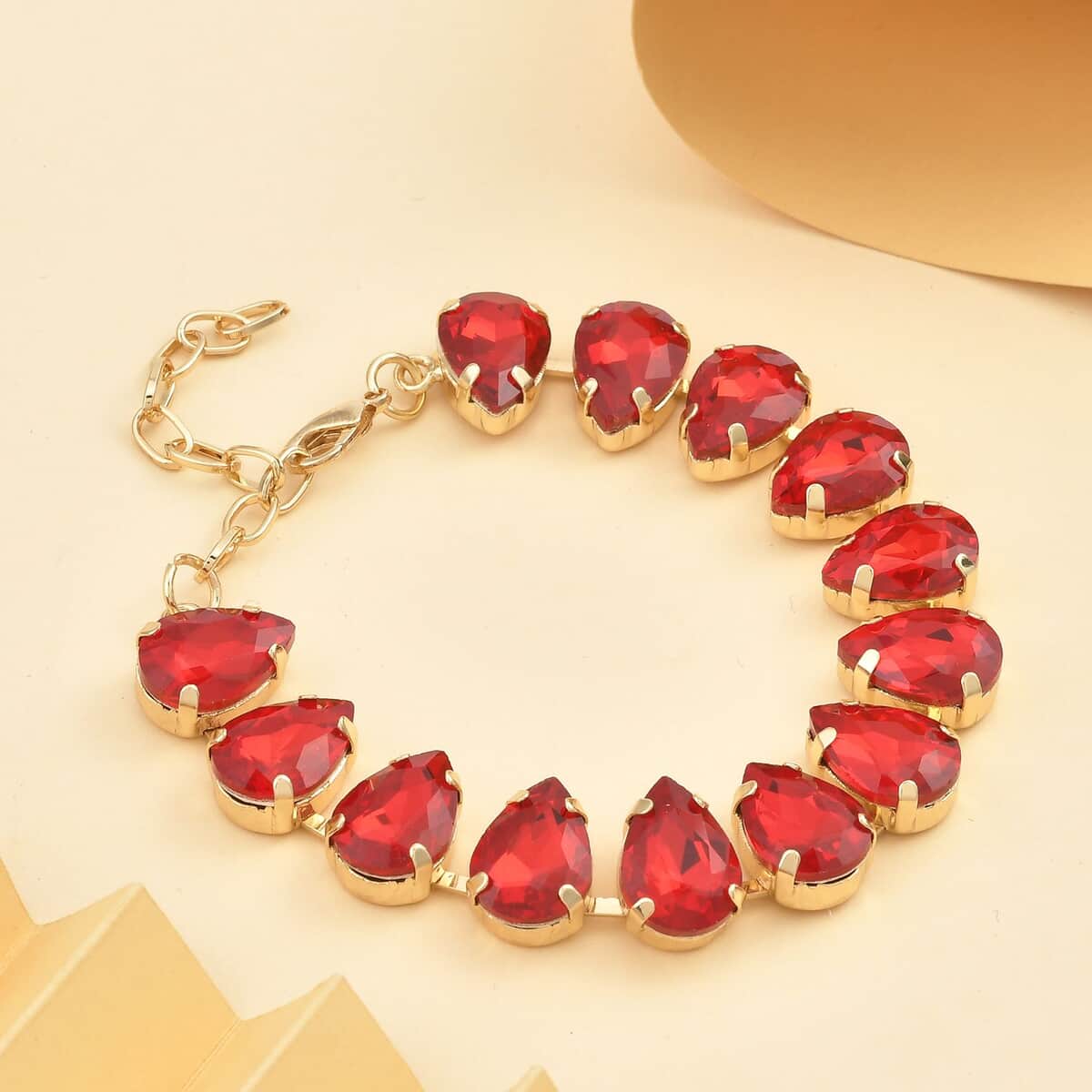 Simulated Ruby Tennis Bracelet in Goldtone (7.50-9.50In) image number 1