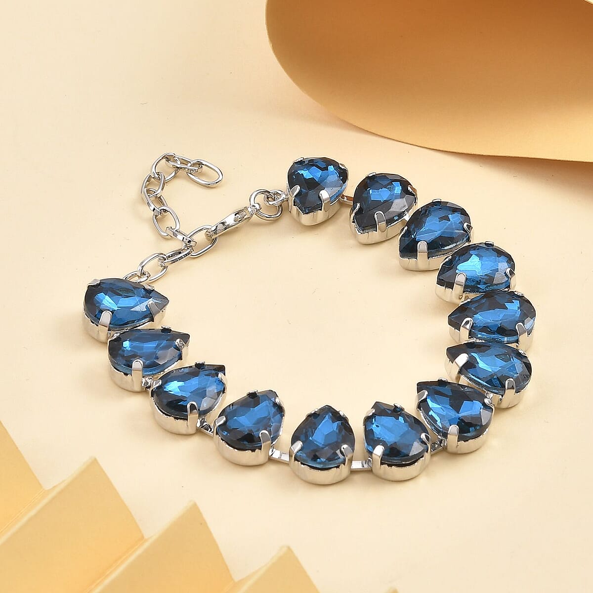 Simulated Blue Topaz Tennis Bracelet in Silvertone (7.50-9.50In) image number 1