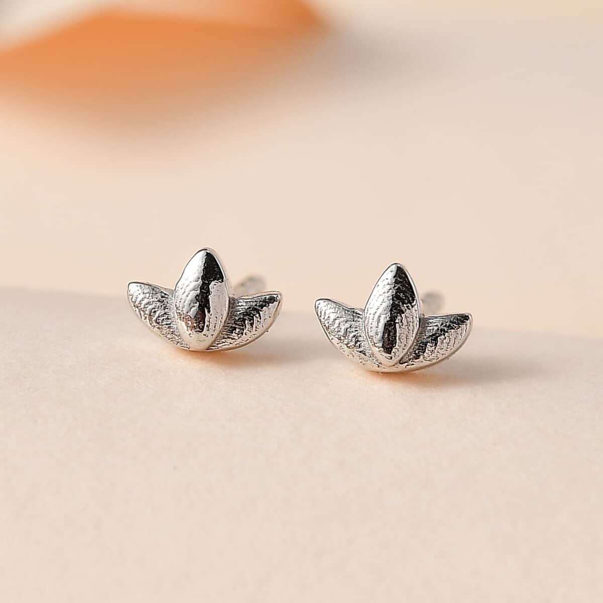 Platinum Over Sterling Silver Lotus Flower Stud Earrings 0.80 Grams image number 1