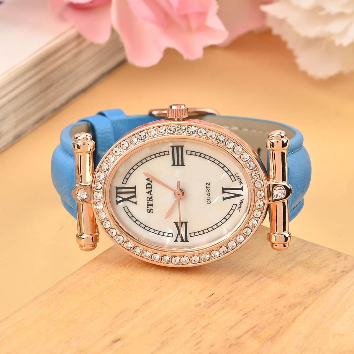 Strada White Austrian Crystal Japanese Movement Watch in Rosetone with Blue Faux Leather Strap (27.94-34.29mm) (6.75-8.50 Inches) image number 1