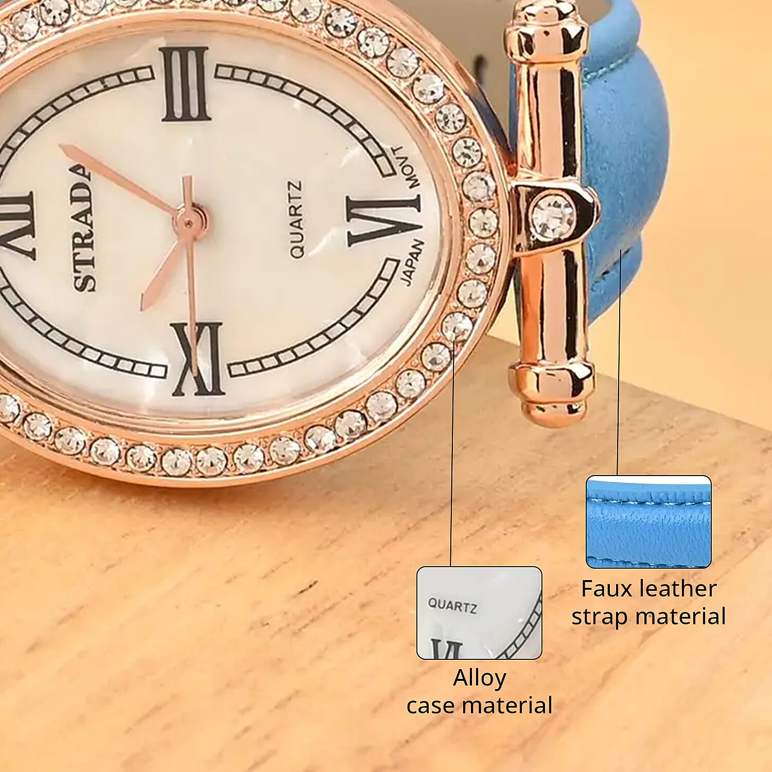 Strada White Austrian Crystal Japanese Movement Watch in Rosetone with Blue Faux Leather Strap (27.94-34.29mm) (6.75-8.50 Inches)