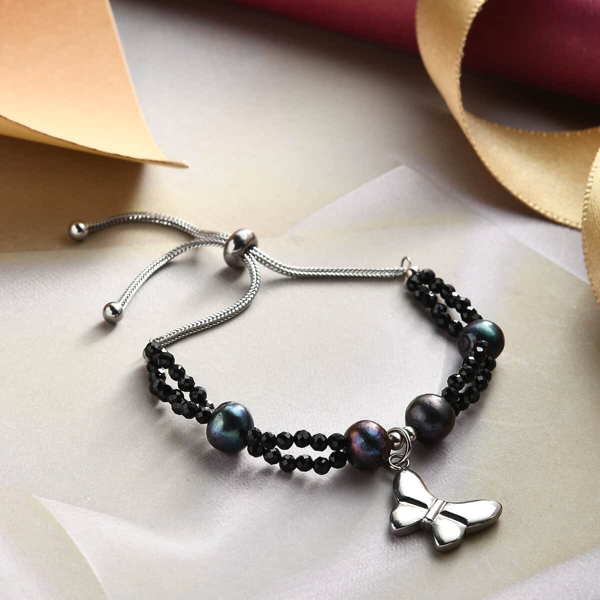 Natural Thai Black Spinel and Peacock Pearl Bolo Bracelet with Butterfly Charm in Stainless Steel 13.45 ctw image number 1