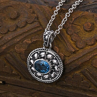 Bali Legacy Swiss Blue Topaz Floral Pendant in Sterling Silver 0.20 ctw