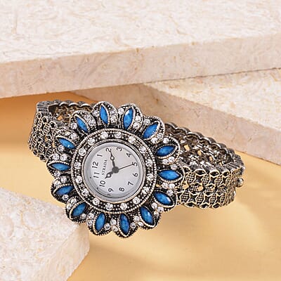 Strada White Austrian Crystal, Simulated Teal Color Resin Japanese Movement Sunflower Pattern Bangle Watch in Silvertone (7.00 Inches)
