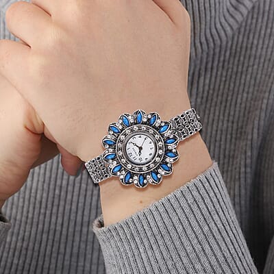 Strada White Austrian Crystal, Simulated Teal Color Resin Japanese Movement Sunflower Pattern Bangle Watch in Silvertone (7.00 Inches)