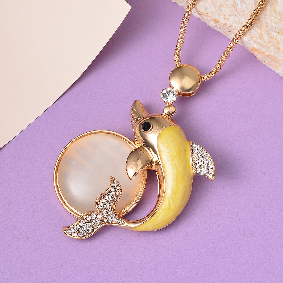 Lab Created White Cat's Eye, White and Black Austrian Crystal Dolphin Necklace in Goldtone 29-31 Inches image number 1