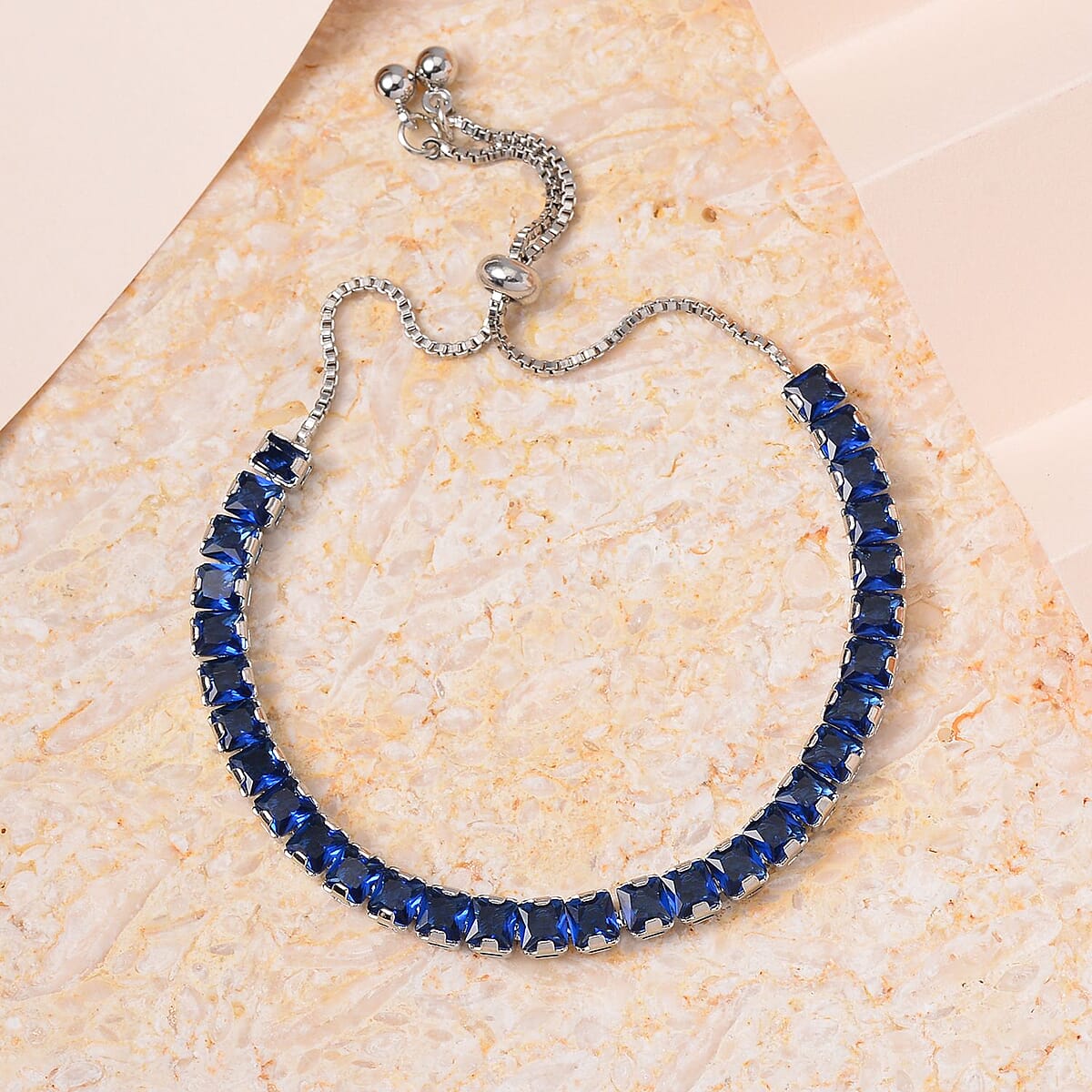 Simulated Blue Sapphire Bolo Bracelet in Silvertone (6-9In) image number 1