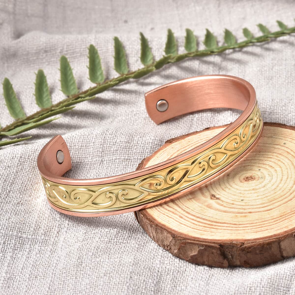 Magnetic By Design Swirl Pattern Cuff Bracelet | Durable Cuff Bracelet | Dual Tone Cuff Bracelet |Cuff Bracelet in Rosetone And Goldtone (7.50 In) image number 1