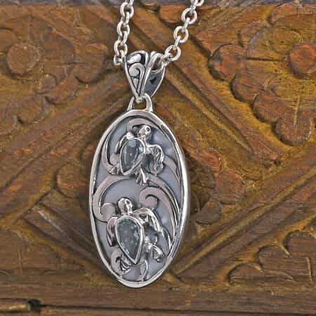 Bali Legacy Mother Of Pearl and Swiss Blue Topaz Turtles Pendant in Sterling Silver 0.70 ctw image number 1