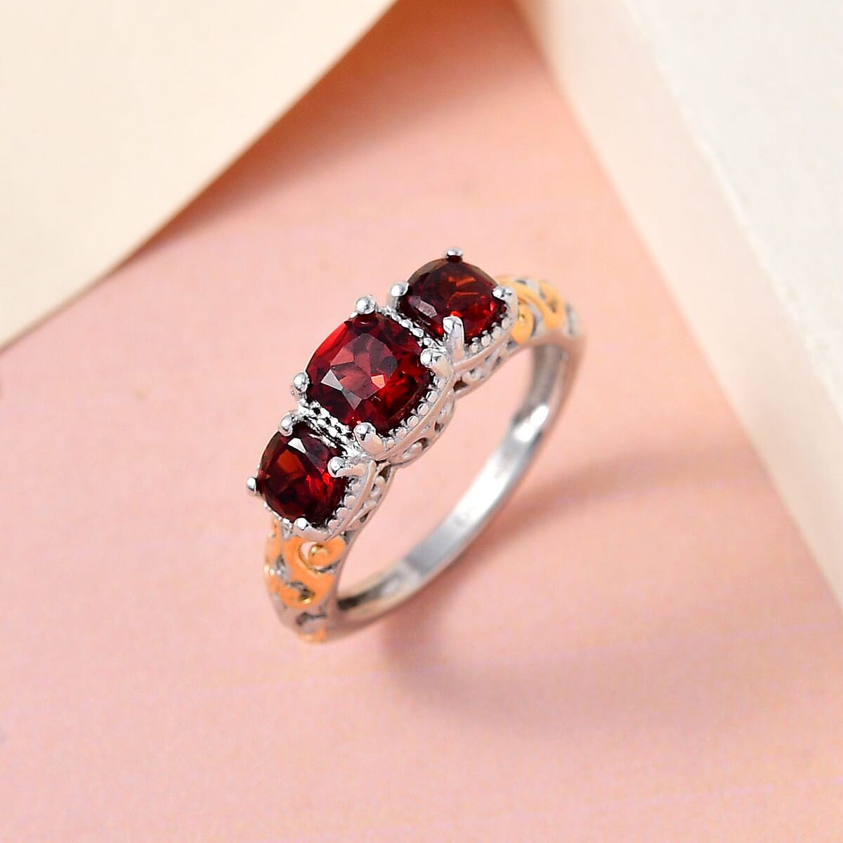 D'Joy Mozambique Garnet 1.50 ctw Trilogy Ring in Vermeil Yellow Gold and Platinum Over Sterling Silver (Size 8.0) image number 3