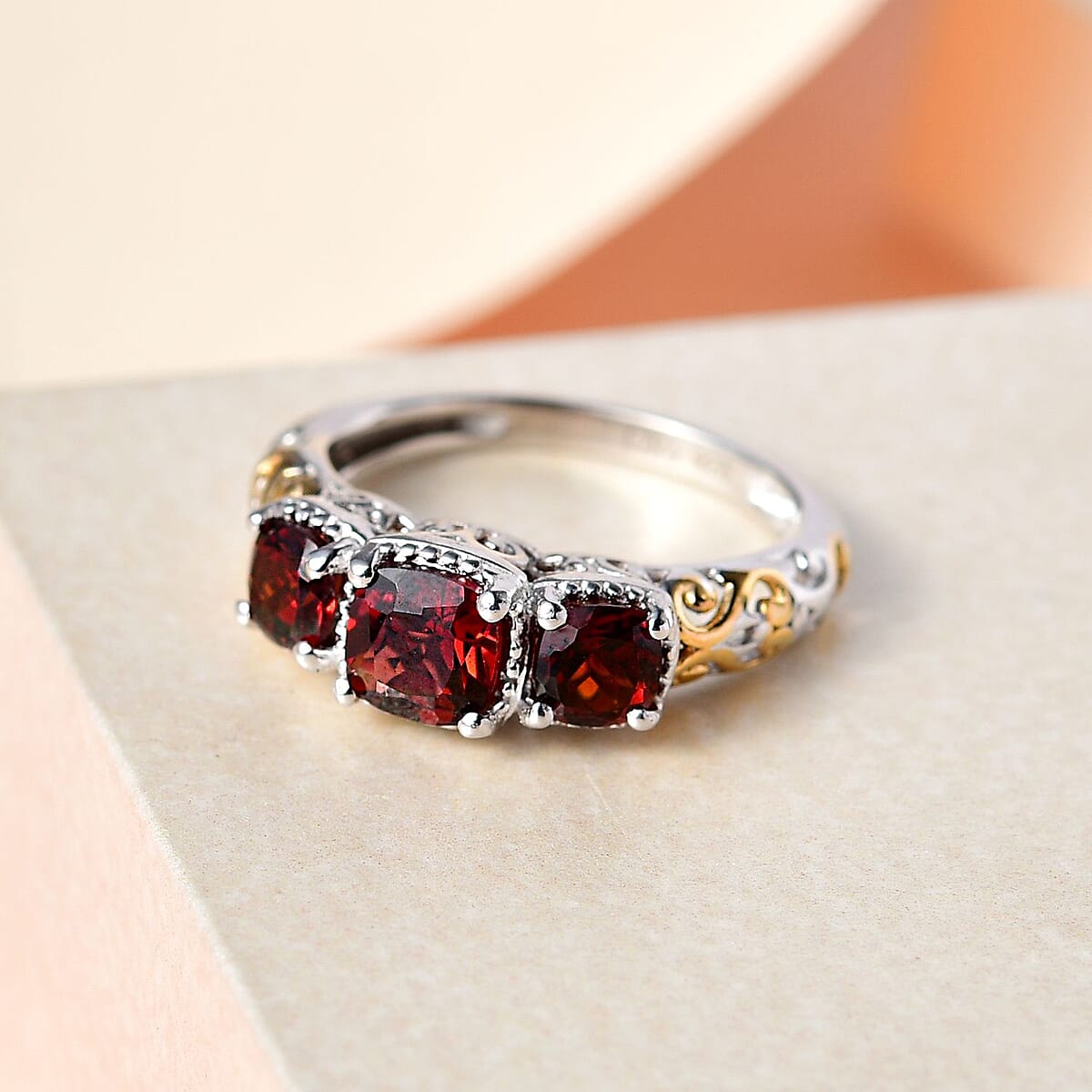 D'Joy Mozambique Garnet 1.50 ctw Trilogy Ring in Vermeil Yellow Gold and Platinum Over Sterling Silver (Size 8.0) image number 4