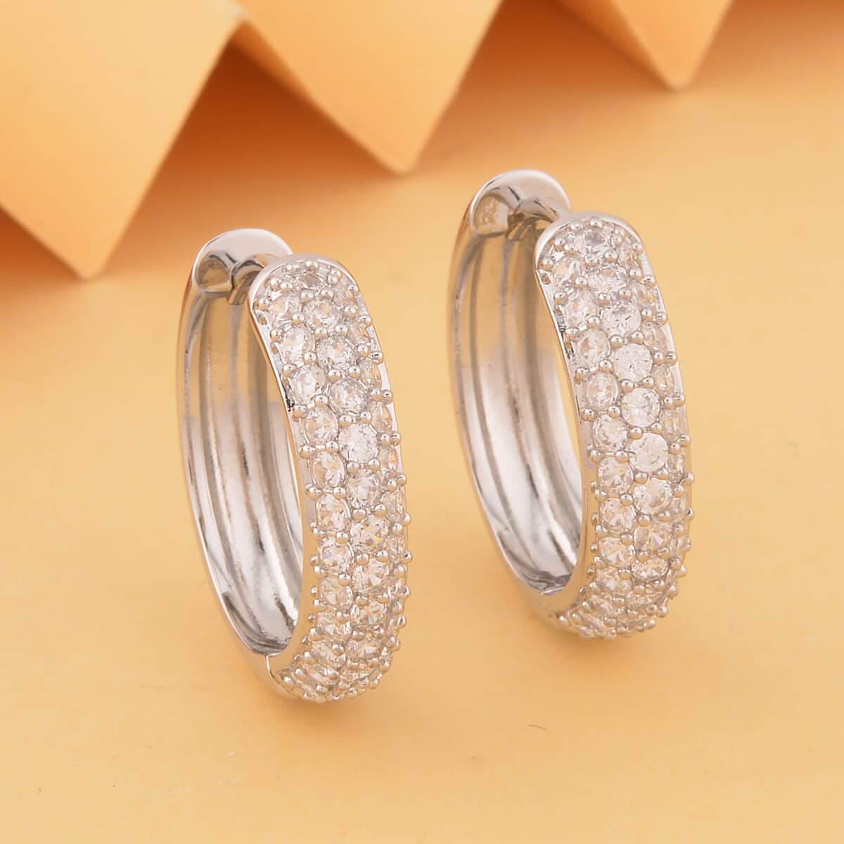 Simulated White Diamond Hoop Earrings in Silvertone 2.90 ctw image number 1