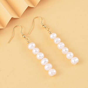 White Freshwater Pearl Dangle Earrings in Goldtone