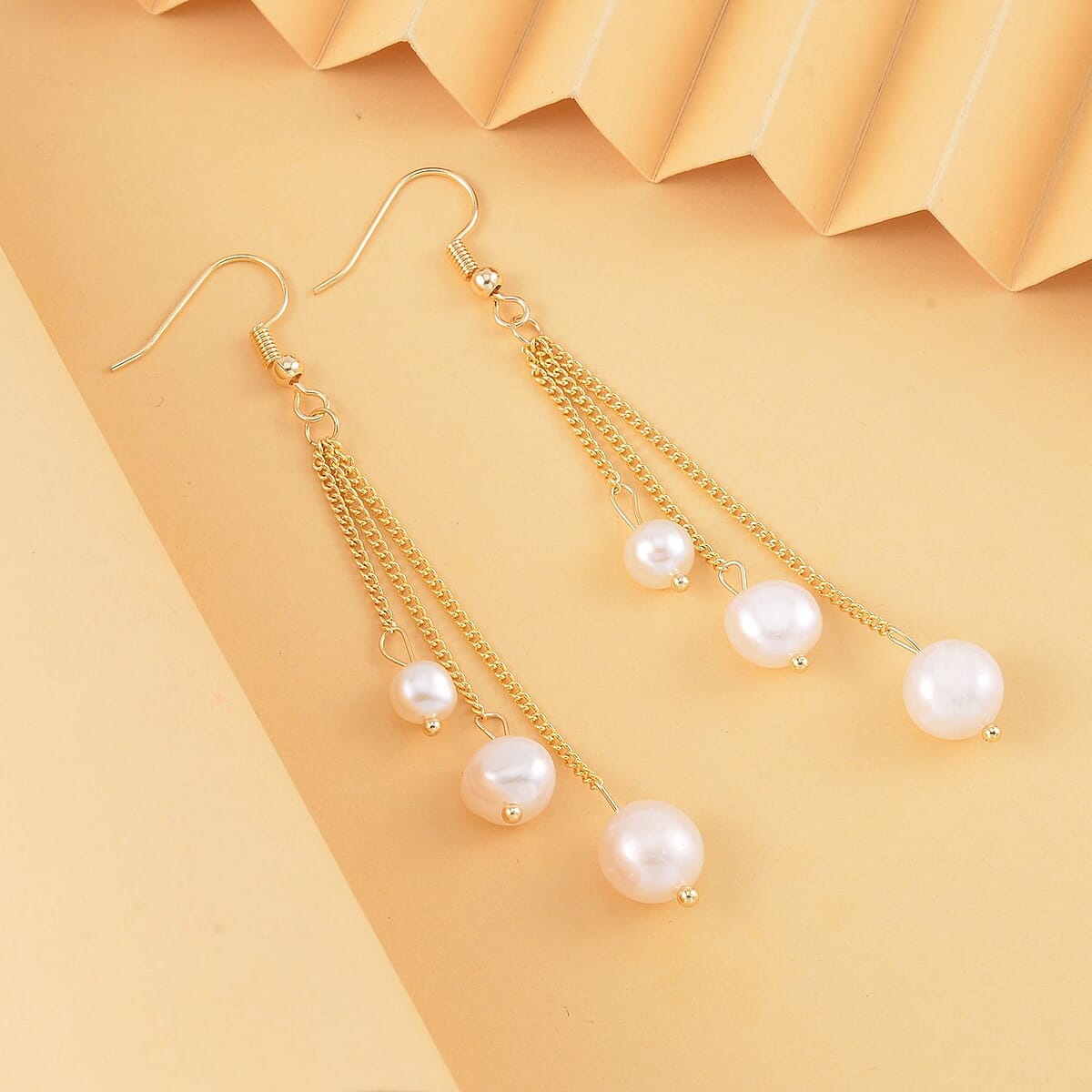 White Fresh Water Pearl Dangle Earrings in Silvertone image number 1
