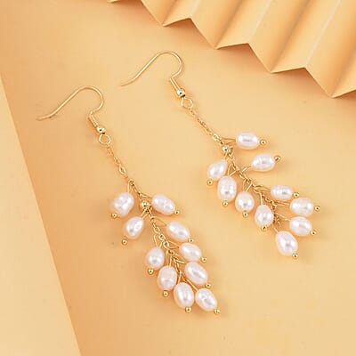 White Freshwater Pearl Dangle Earrings in Goldtone