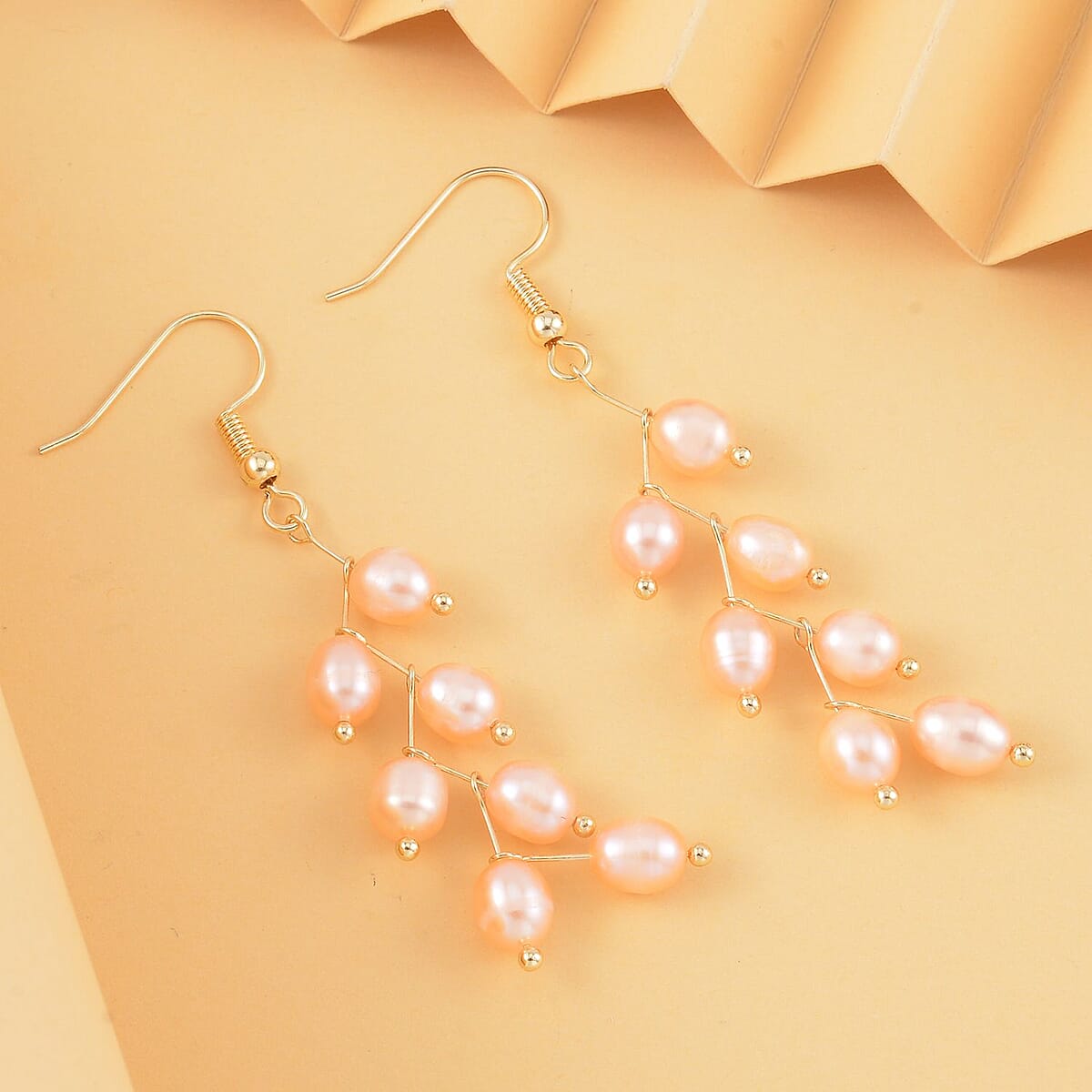 Peach Freshwater Pearl Dangle Earrings in Goldtone image number 1
