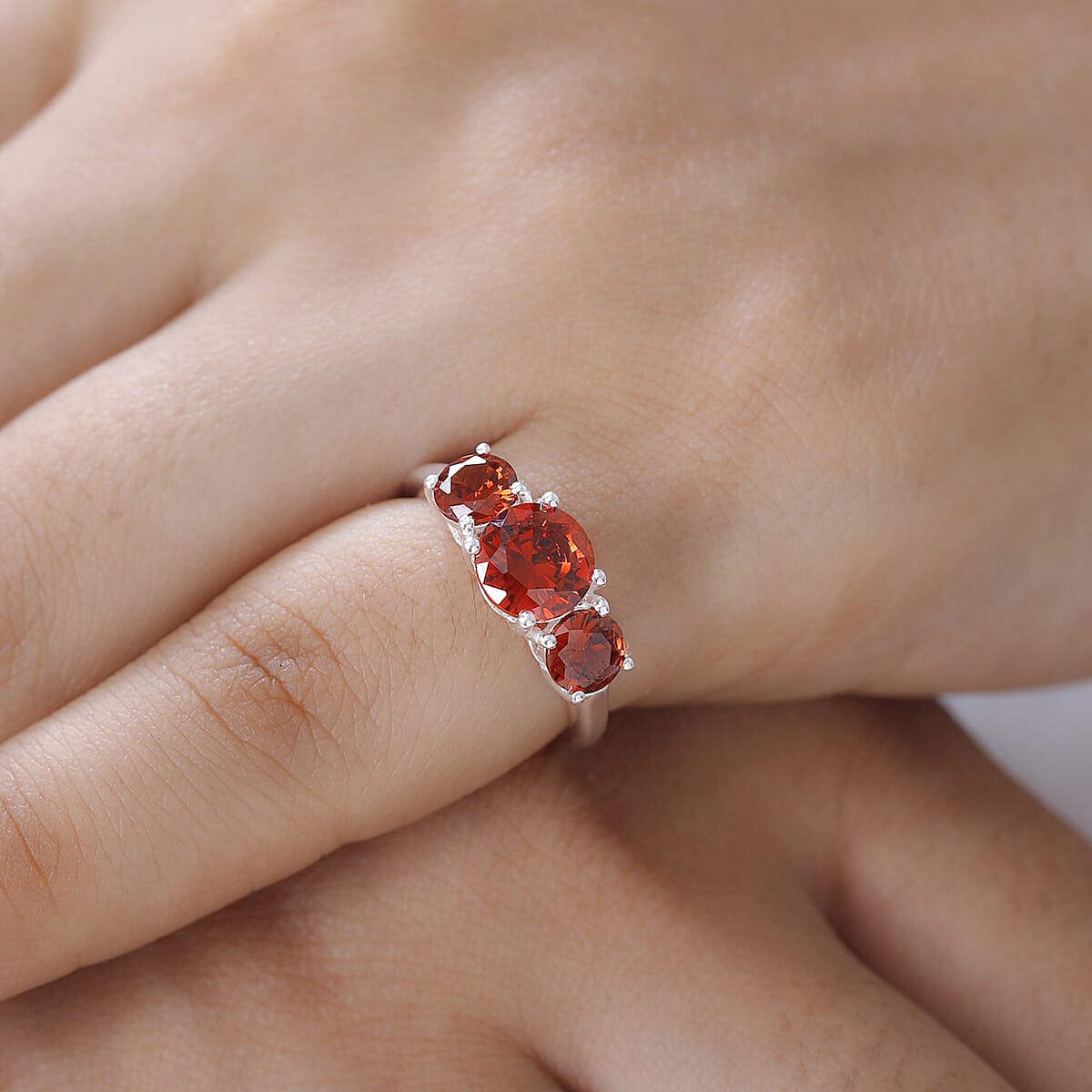 Simulated Garnet Color Diamond 3 Stone Ring in Sterling Silver 3.75 ctw image number 2