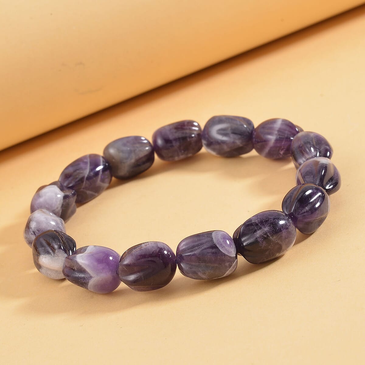 Bi-Color Amethyst Carved Beaded 142 ctw Stretch Bracelet  image number 1