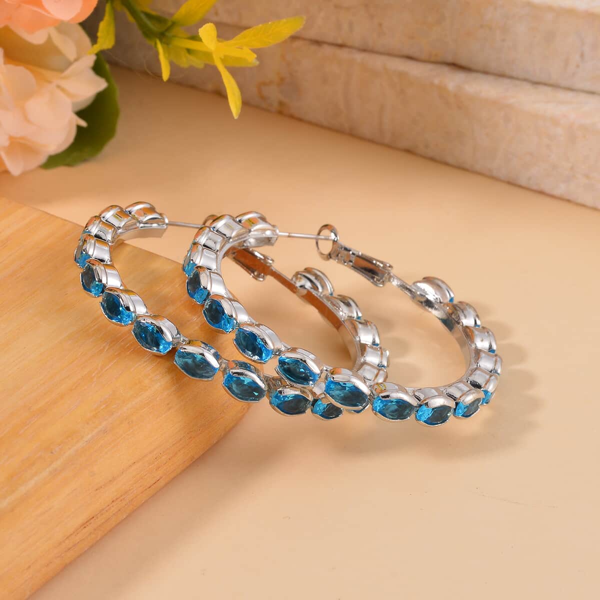 Bargain Deal Simulated Blue Sapphire Hoop Earrings in Silvertone image number 1