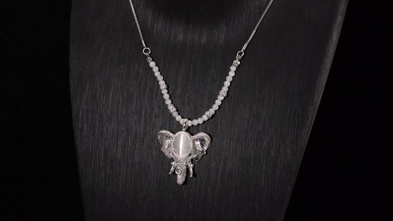 Lab Created White Cat's Eye and Austrian Crystal Elephant Pendant with Necklace in Silvertone 28-30 Inches