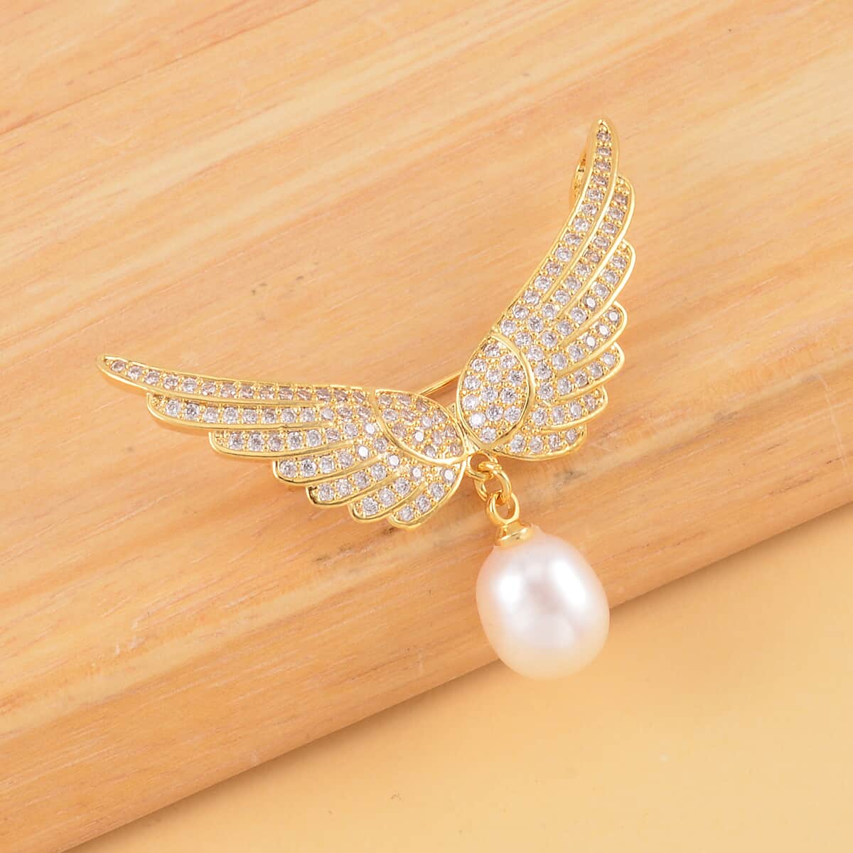 White Freshwater Pearl and Simulated Diamond Eagle Wing Brooch in Goldtone 1.15 ctw image number 1