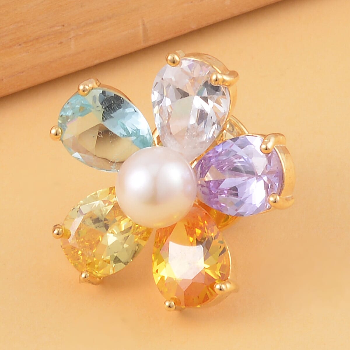 Simulated Multi Color Diamond and White Freshwater Pearl Floral Brooch in Goldtone image number 1