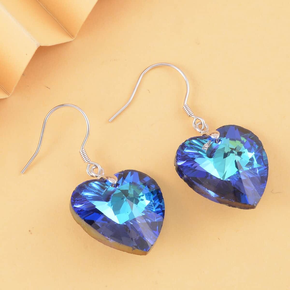 Simulated Blue Sapphire Heart Dangle Earrings in Rhodium Over Sterling Silver image number 1