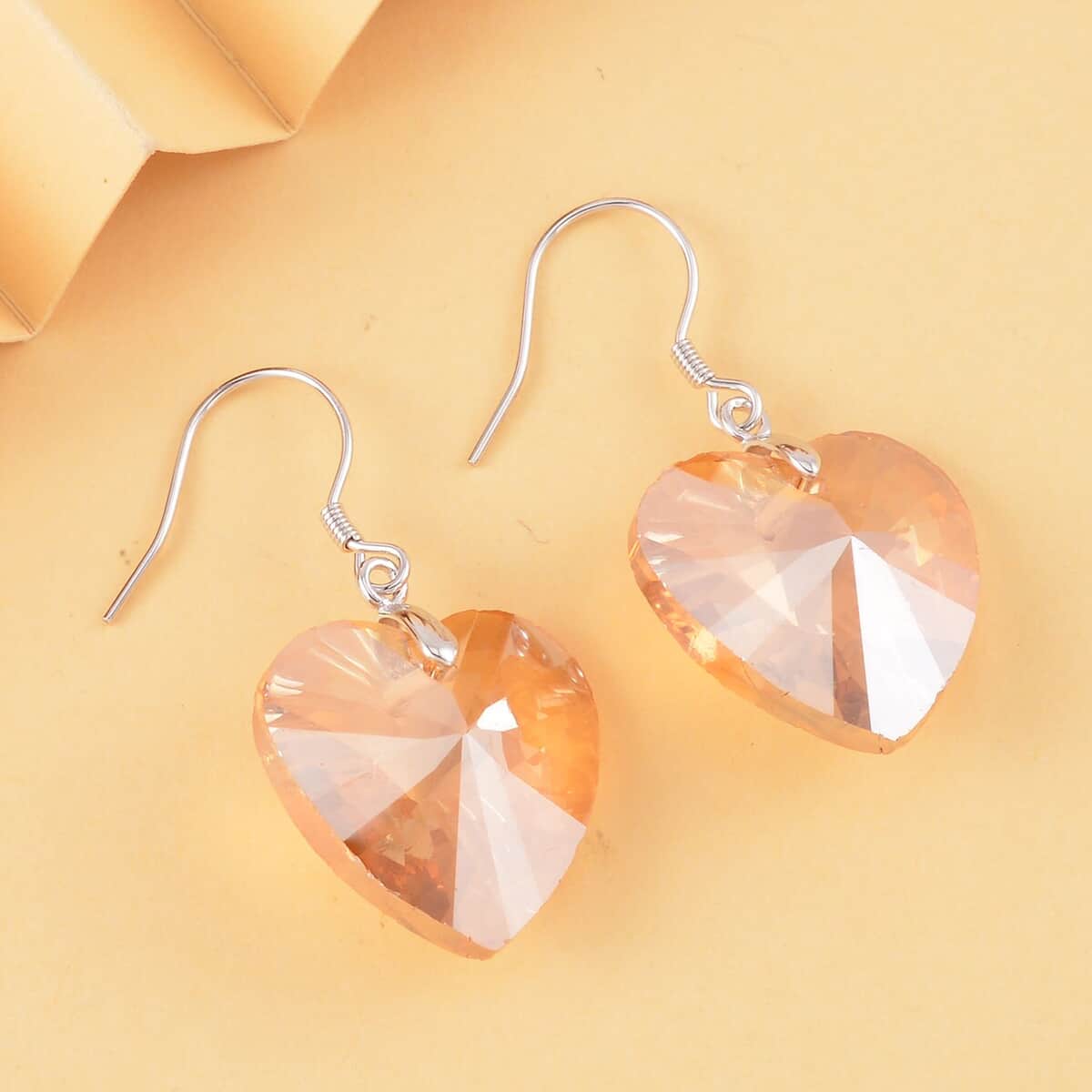 Simulated Champagne Color Quartz Heart Dangle Earrings in Rhodium Over Sterling Silver image number 1