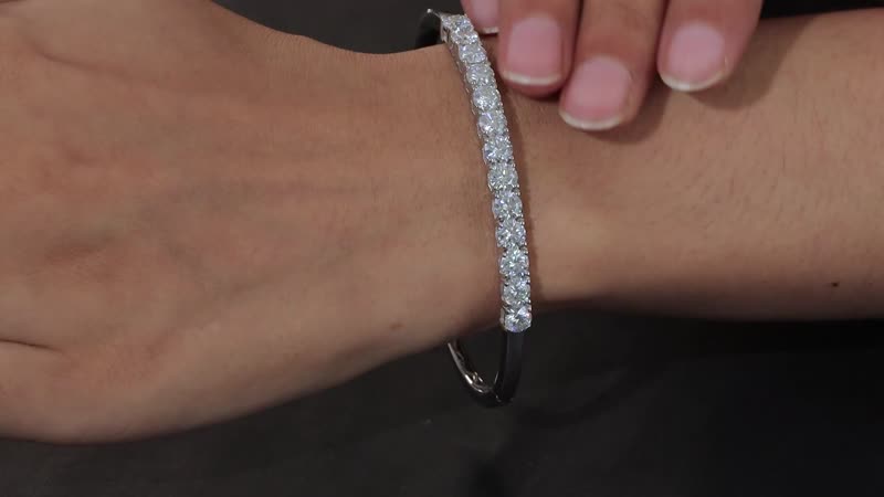 Moissanite Bangle Bracelet in Platinum Over Sterling Silver (7.25 In) 5.60 ctw