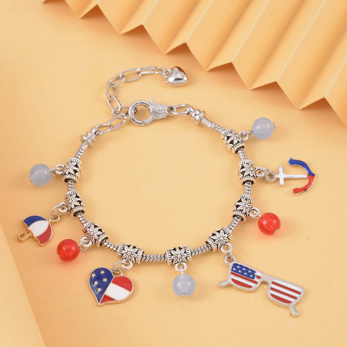 Blue and Red Glass and Enameled American Flag Pattern Bracelet in Silvertone (7-9In) image number 1