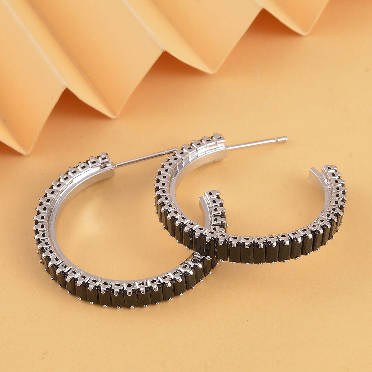 Simulated Black Diamond Hoop Earrings in Silvertone image number 1