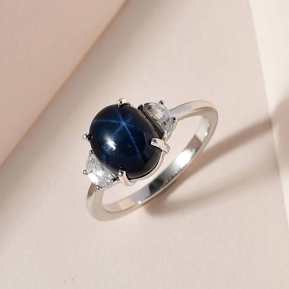 Blue Star Sapphire (DF) and White Zircon Ring in Platinum Over Sterling Silver (Size 9.0) 4.85 ctw image number 1