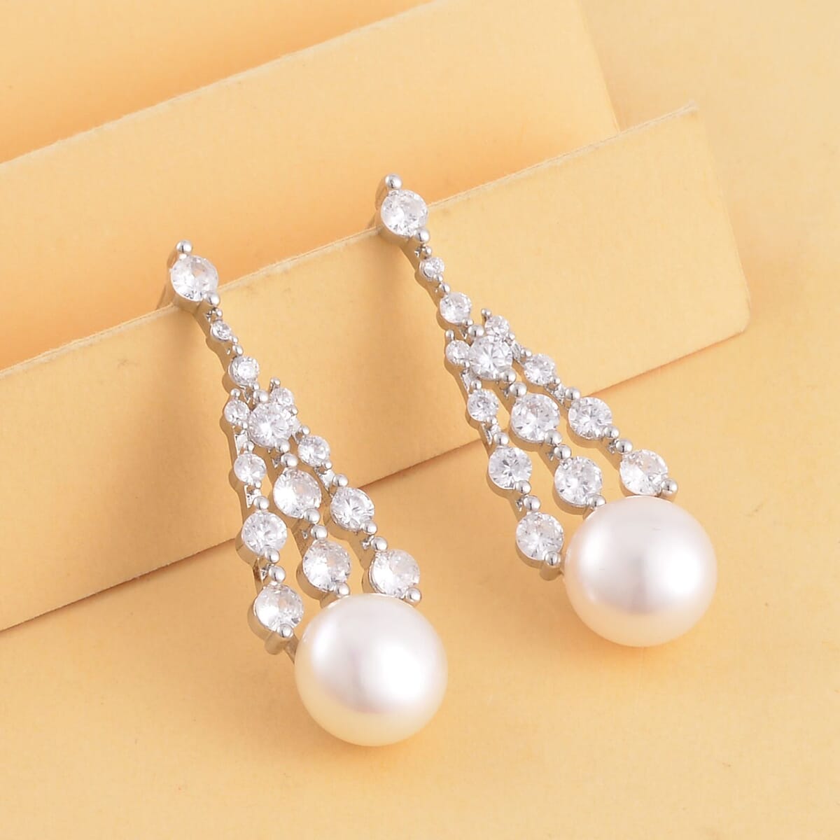 White Freshwater Pearl and Simulated Diamond Earrings in Silvertone 0.60 ctw image number 1