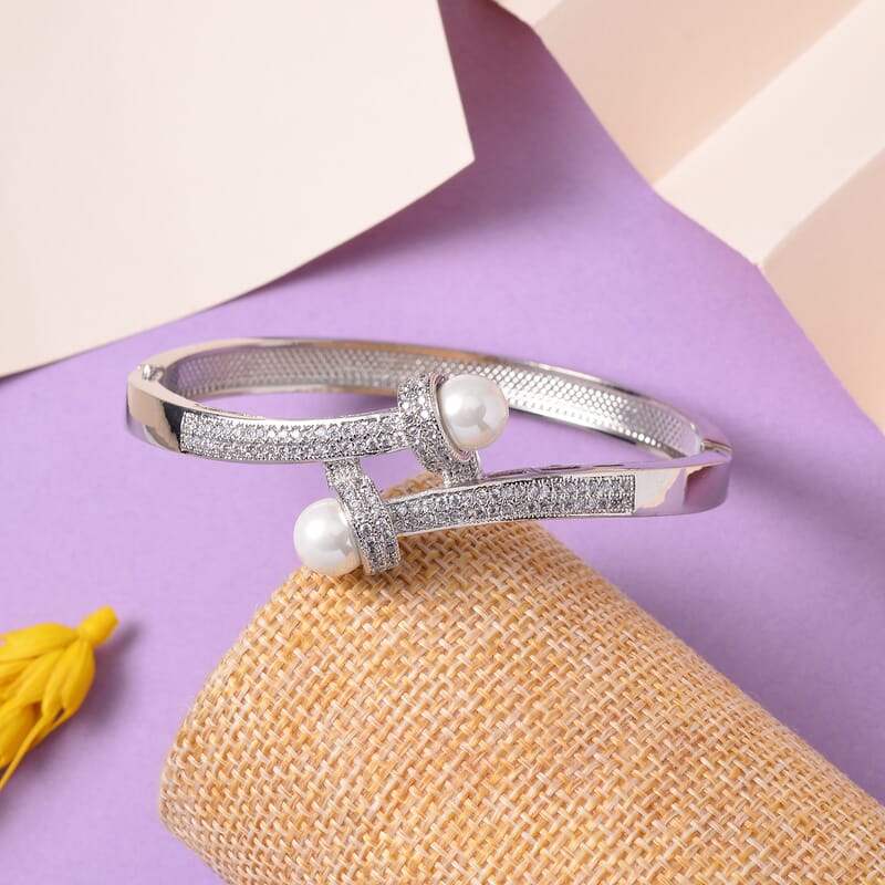 Simulated Pearl and Simulated Diamond Bypass Bangle Bracelet in Silvertone (7.0 In) 1.00 ctw