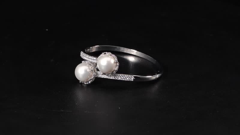 Simulated Pearl and Simulated Diamond Bypass Bangle Bracelet in Silvertone (7.0 In) 0.70 ctw